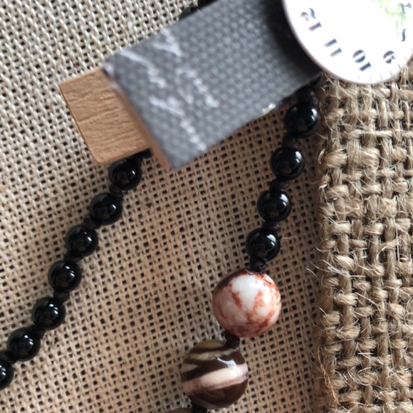 Gold Pony pendant on zebra beads - Picture 3 of 3